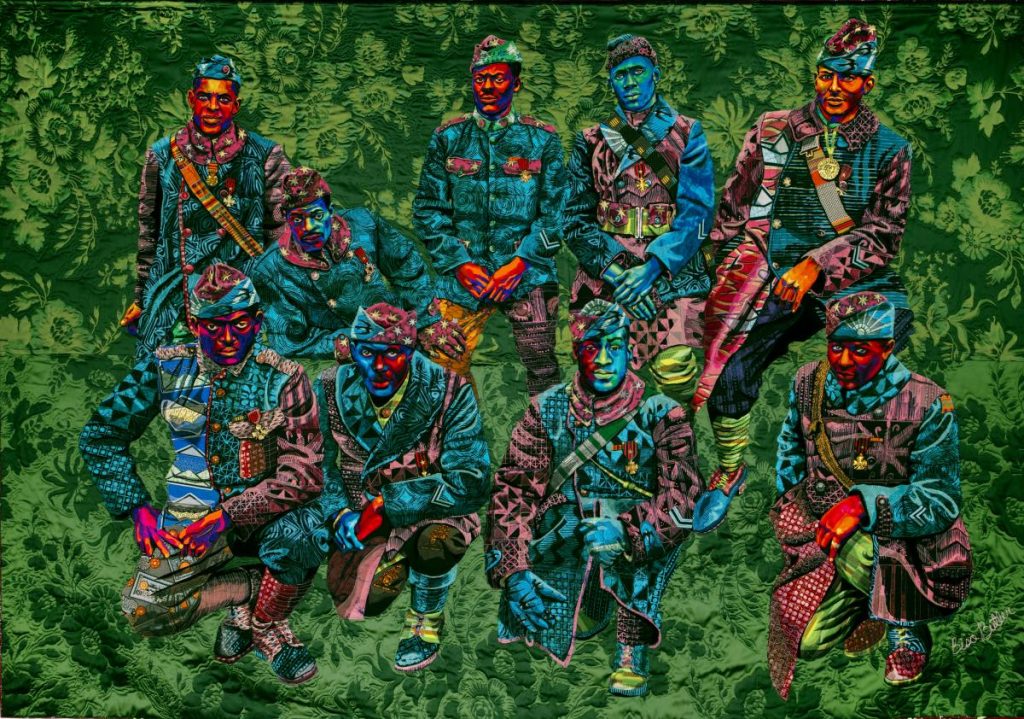 A quilt with colorful Harlem Hellfighters and a green forested background